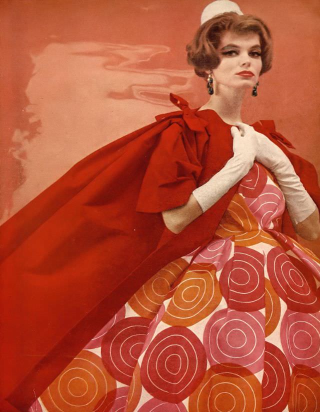 Jan Rylander In Silk Strapless Dress Circled In Vivid Colors Worn With A Red Gros De Londres Coat With Wide Sleeves By Scaasi, Hat By Em
