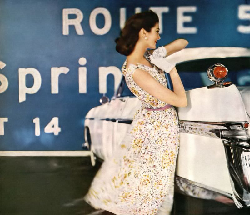 Carmen Dell'Orefice In Summery Shift Of A Dress Dappled With Wild Flowers And Sashed With A Ribbon By David Crystal, The Car Is Chrysler'S Imperial &Amp;Quot;Southampton&Amp;Quot;, Harper'S Bazaar U.s., May 1956