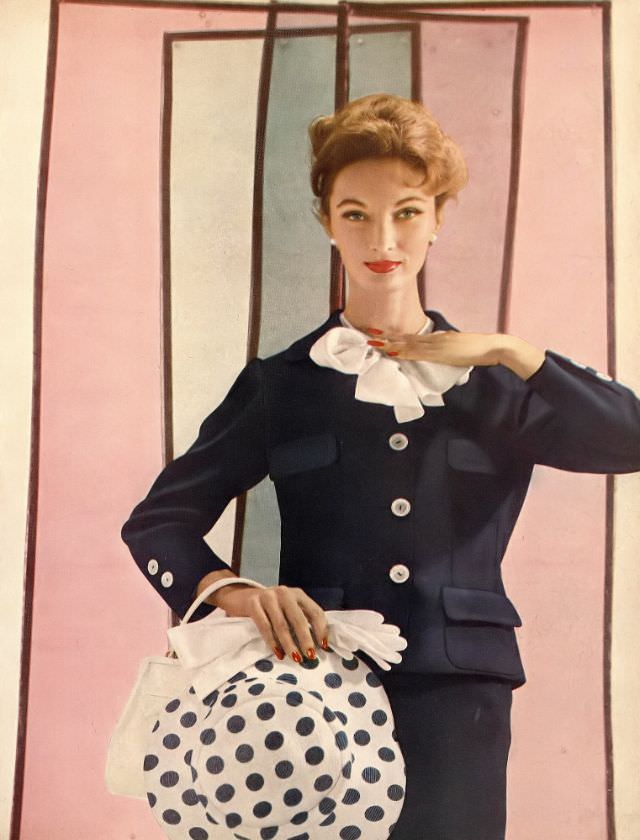 Evelyn Tripp In Navy Blue Suit With White Blouse Bowed At The Collar, Harper'S Bazaar, February 1957