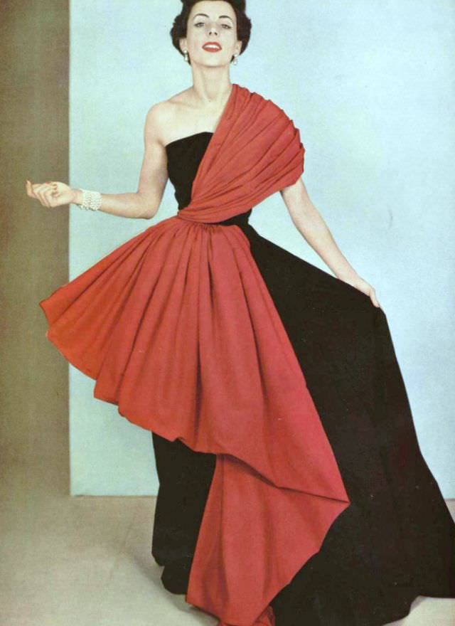 Model In Intricately Draped Red Faille On Black Faille Gown By Grès, 1950