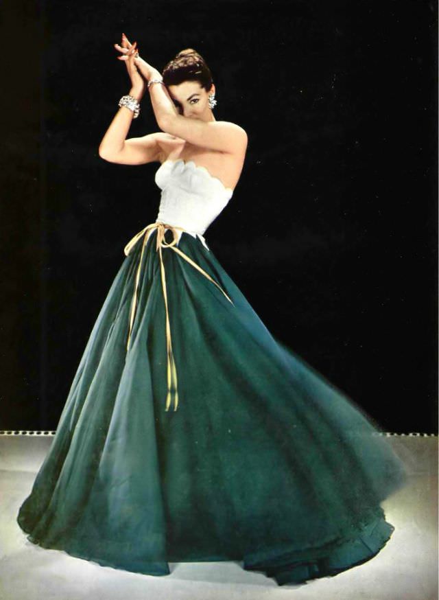 Lucky In Evening Gown, The Skirt In Two Tones Of Silk Organza, The Bodice Is Scalloped On Top And Pointed Below The Waist, Tied With Gold Ribbons, By Grès, 1954
