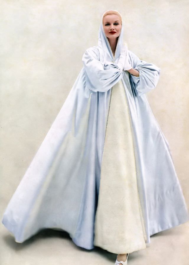 Sunny Hartnett In A Billowing Hooded Evening Coat Of Ice Blue Satin By Grès, 1954