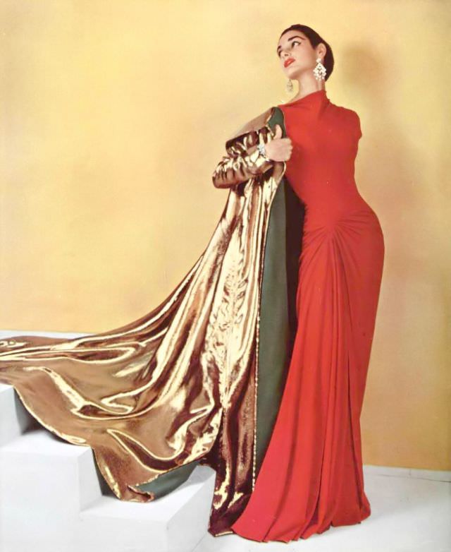 Jacky Mazel In Figure-Hugging Coral Silk-Jersey Evening Dress Worn With Gold Lamé Evening Coat By Grès, Chandelier Earrings By Scémama, 1955