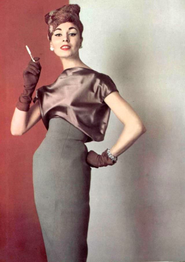 Model In Elegant Understated Gray Wool Dress With Satin Blouson Bodice By Grès, Hat By Svend, 1956