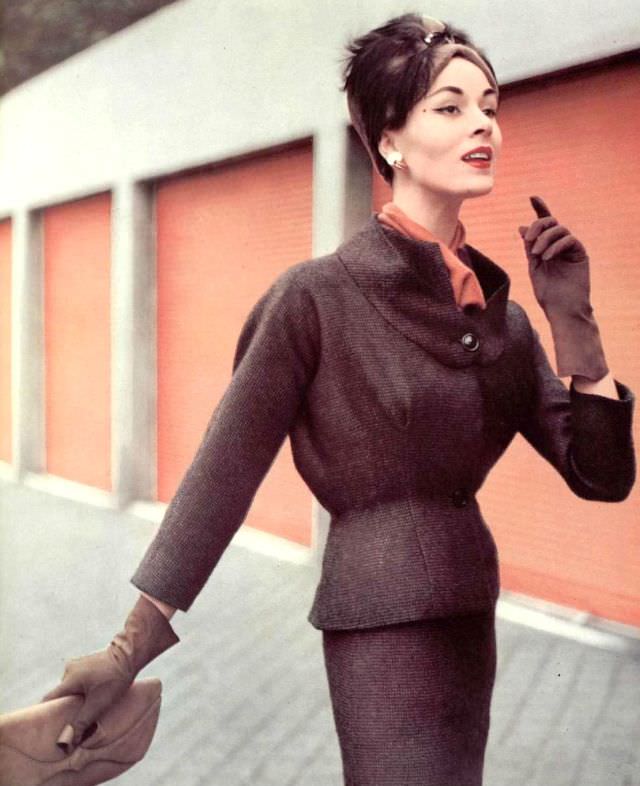 Model In Fine Wool Checked Suit, Jacket Has Expanded Bust And Flexible Back, Worn Over Jersey Blouse, By Grès, Hat By Legroux, Clutch By Muth, 1956