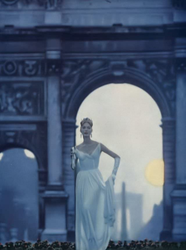 Model In White Crêpe Gown Flowing Out Of Itself Into Pleats That Follow The Shape Of The Figure By Grès, Vogue, October 1, 1957