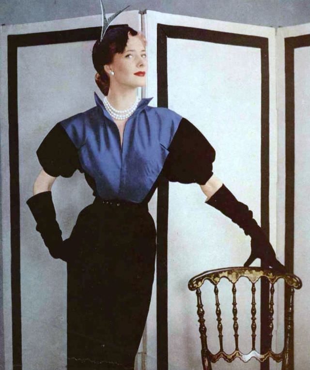 Model In Black Wool Sheath Dress, The Bodice Is Of Peacock Blue Faille, By Grès, 1951