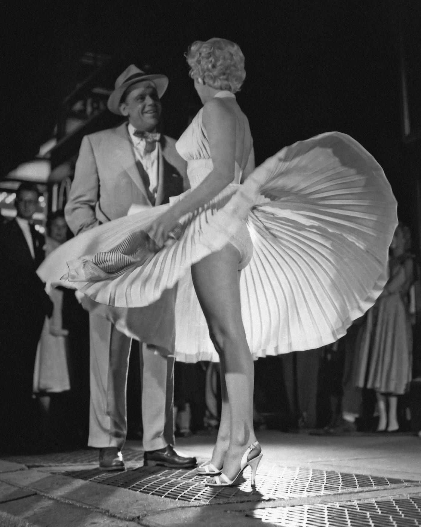 Marilyn Monroe With The Skirt Of Her White Dress Blowing As She Stands Over A Subway Grate