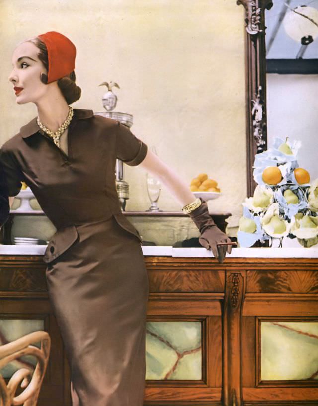 Cherry Nelms In Taupe Silk Twill Sheath By Mollie Parnis, Red Brushed Velours Cap By John Frederics, Gold And Diamond Necklace And Bracelet By Van Cleef &Amp;Amp; Arpels, July 1953