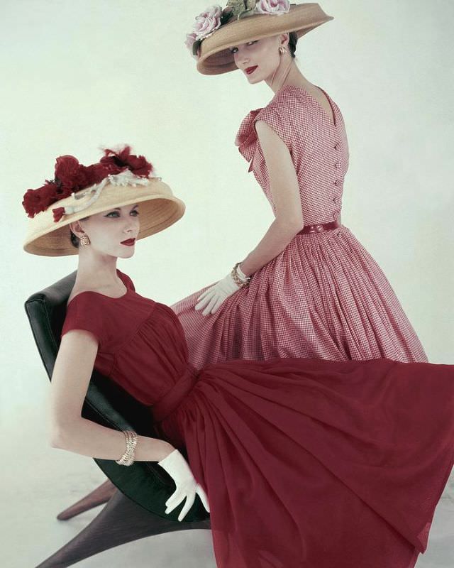 Evelyn Tripp And Joan Friedman In Dresses By Mollie Parnis And Flowered Hats By Adolfo Of Emme, Vogue, April 15, 1956