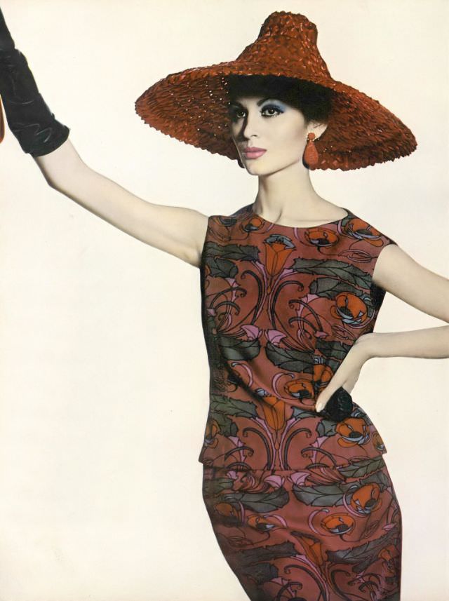 Isabella Albonico In Boldly Colored Plum-Red And Blue Print Two-Piece Dress On Liberty Of London Silk By Mollie Parnis, Red Straw Pagoda Hat By Sally Victor, Earrings By Hattie Carnegie, Vogue, April 1, 1961