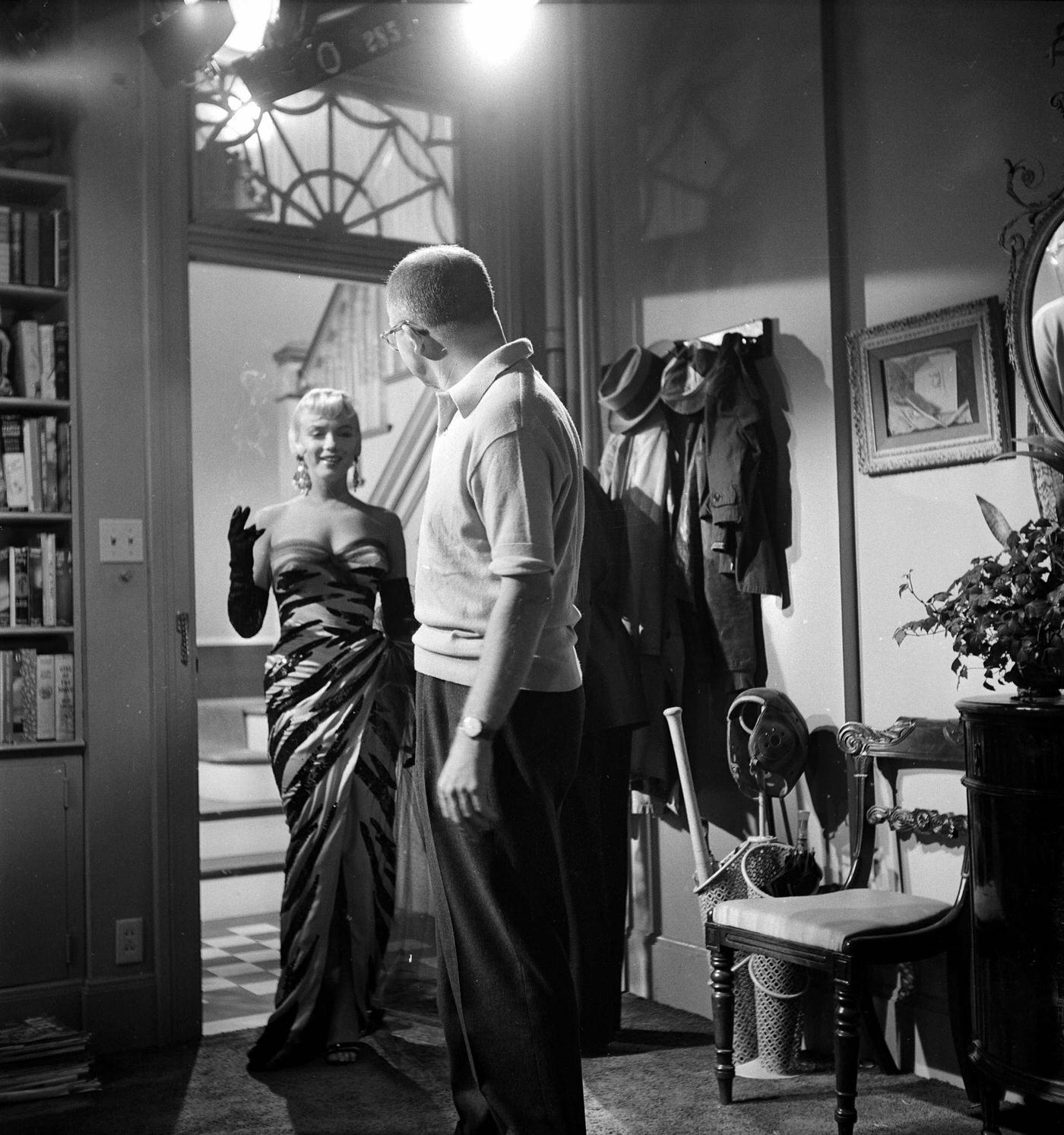Monroe Stands In A Doorway Wearing A Tiger-Striped Dress On Set With Director Billy Wilder In 1954 During The Filming Of &Amp;Quot;The Seven Year Itch&Amp;Quot;