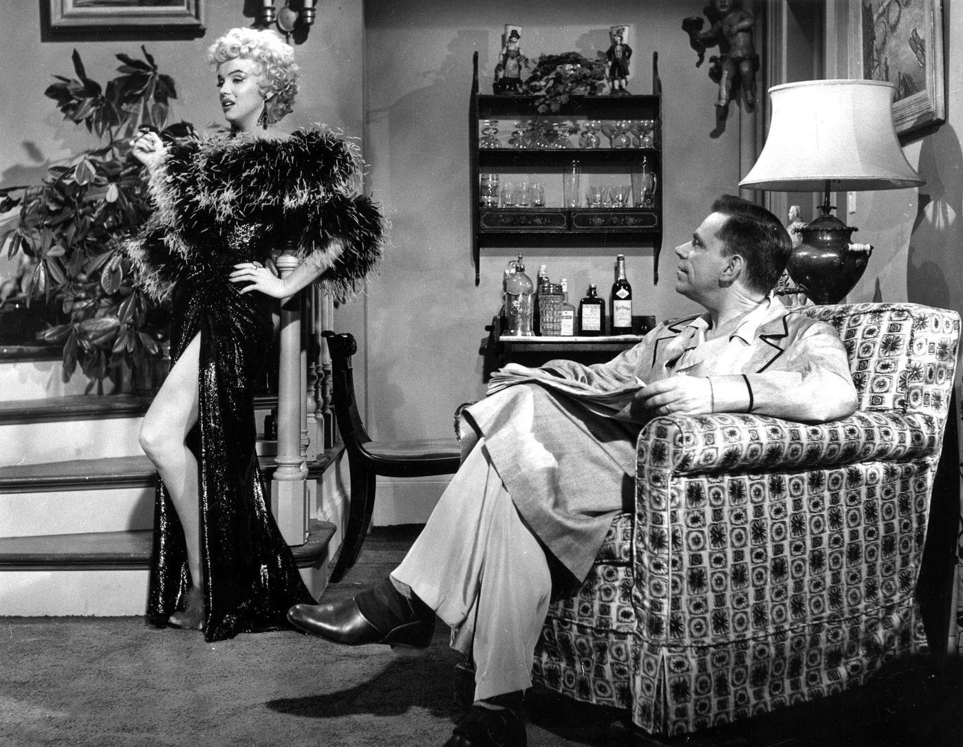 Marilyn Monroe Wearing A Feather Boa With Co-Star Tom Ewell During The Filming Of &Amp;Quot;The Seven Year Itch&Amp;Quot; In 1954