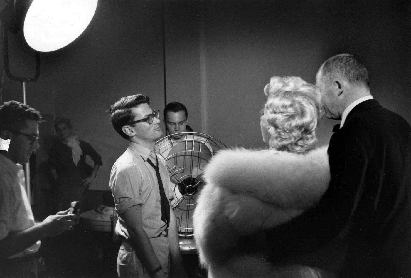 Marilyn Monroe Stands Wearing A White Fur Stole Wrap With Director Billy Wilder For A Publicity Shoot With Richard Avedon In His Studio During The Making Of &Amp;Quot;The Seven Year Itch&Amp;Quot;