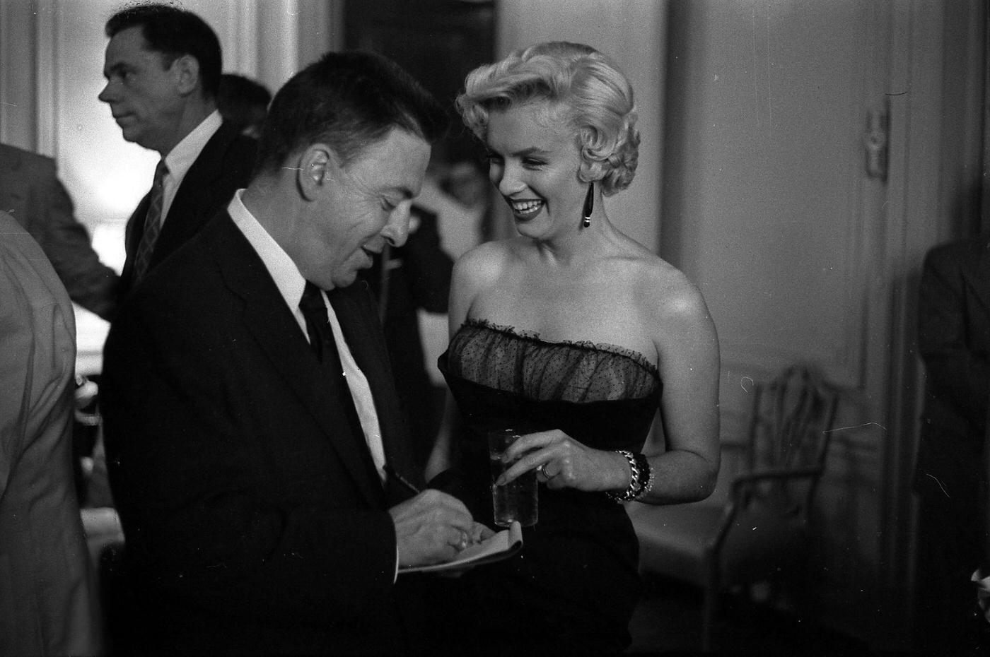 Marilyn Monroe With Co-Star Tom Ewell And Newspaper Columnist Earl Wilson At A Press Party For &Amp;Quot;The Seven Year Itch&Amp;Quot; In 1954 In New York