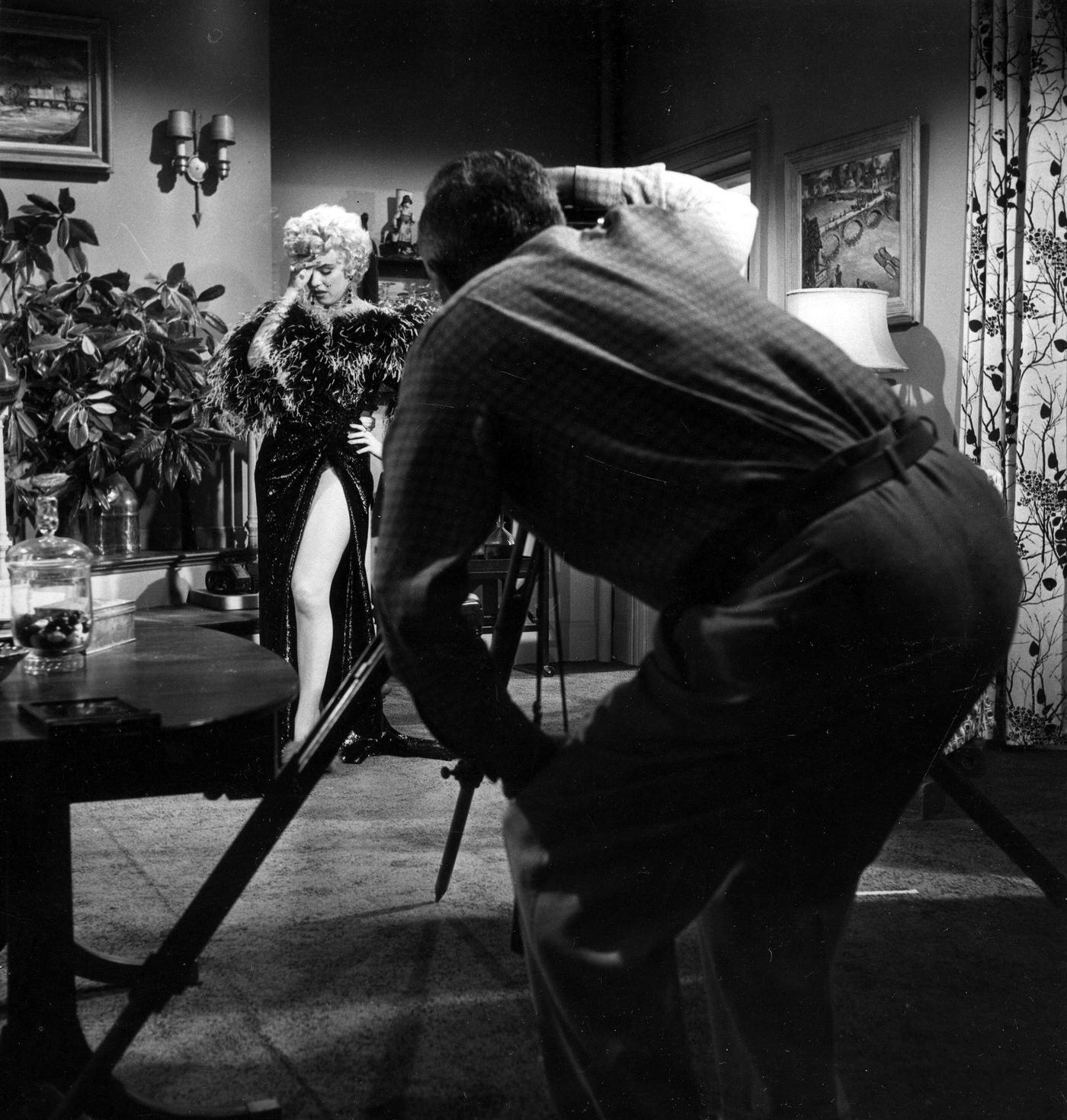Marilyn Monroe In Front Of A Camera Wearing A Feather Boa During The Filming Of &Amp;Quot;The Seven Year Itch&Amp;Quot; In 1954