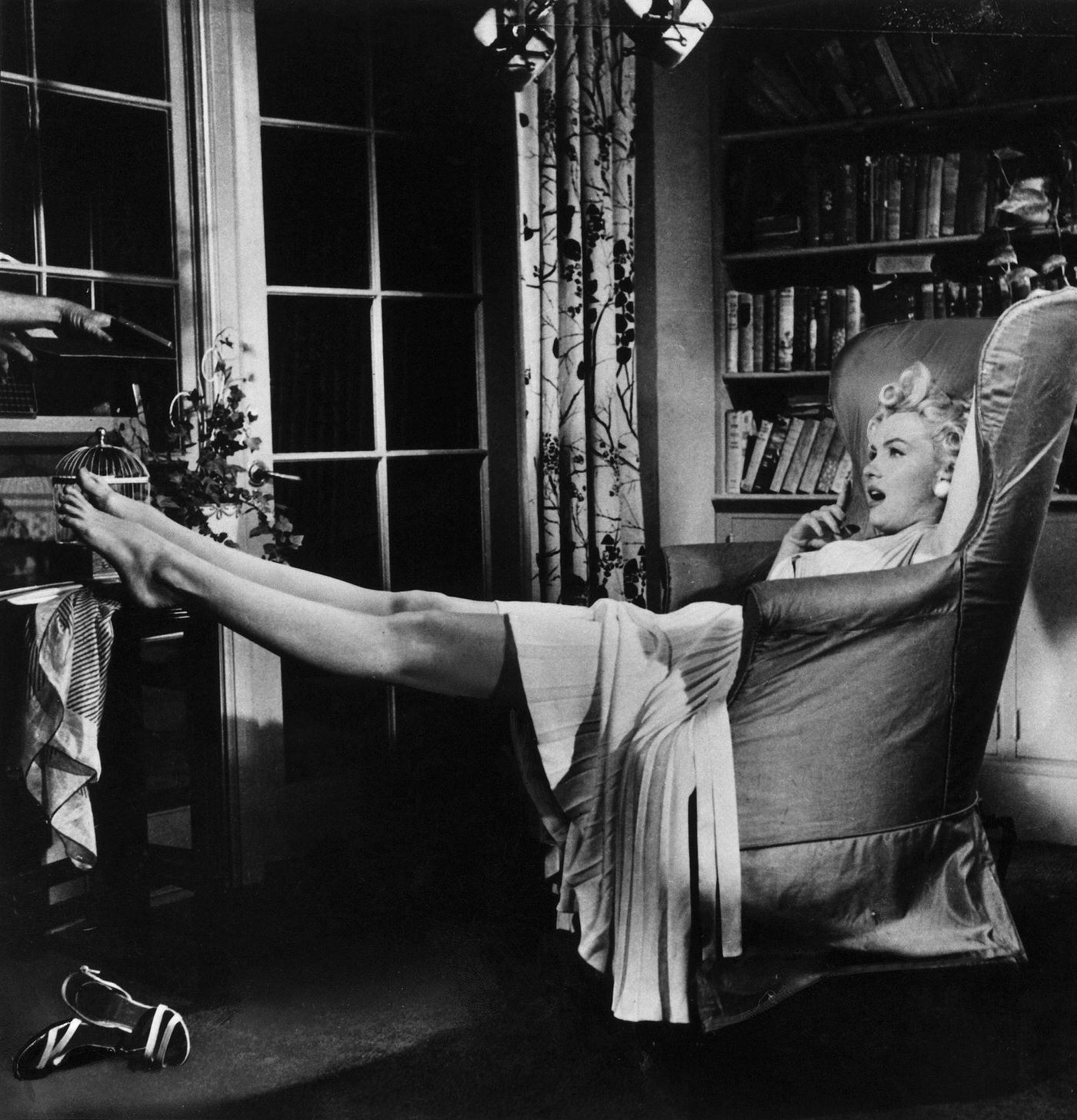 Marilyn Monroe Reclines In An Armchair On Set During The Filming Of &Amp;Quot;The Seven Year Itch&Amp;Quot; In 1954 In Los Angeles