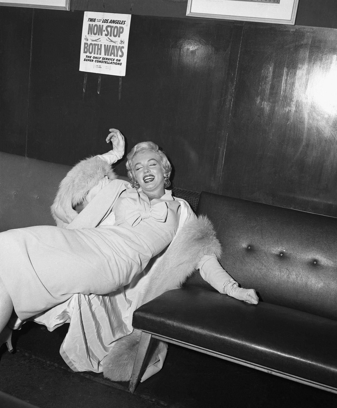Marilyn Monroe Portrays Exhaustion In Idlewild Airport After A Cross-Country Flight From Los Angeles.
