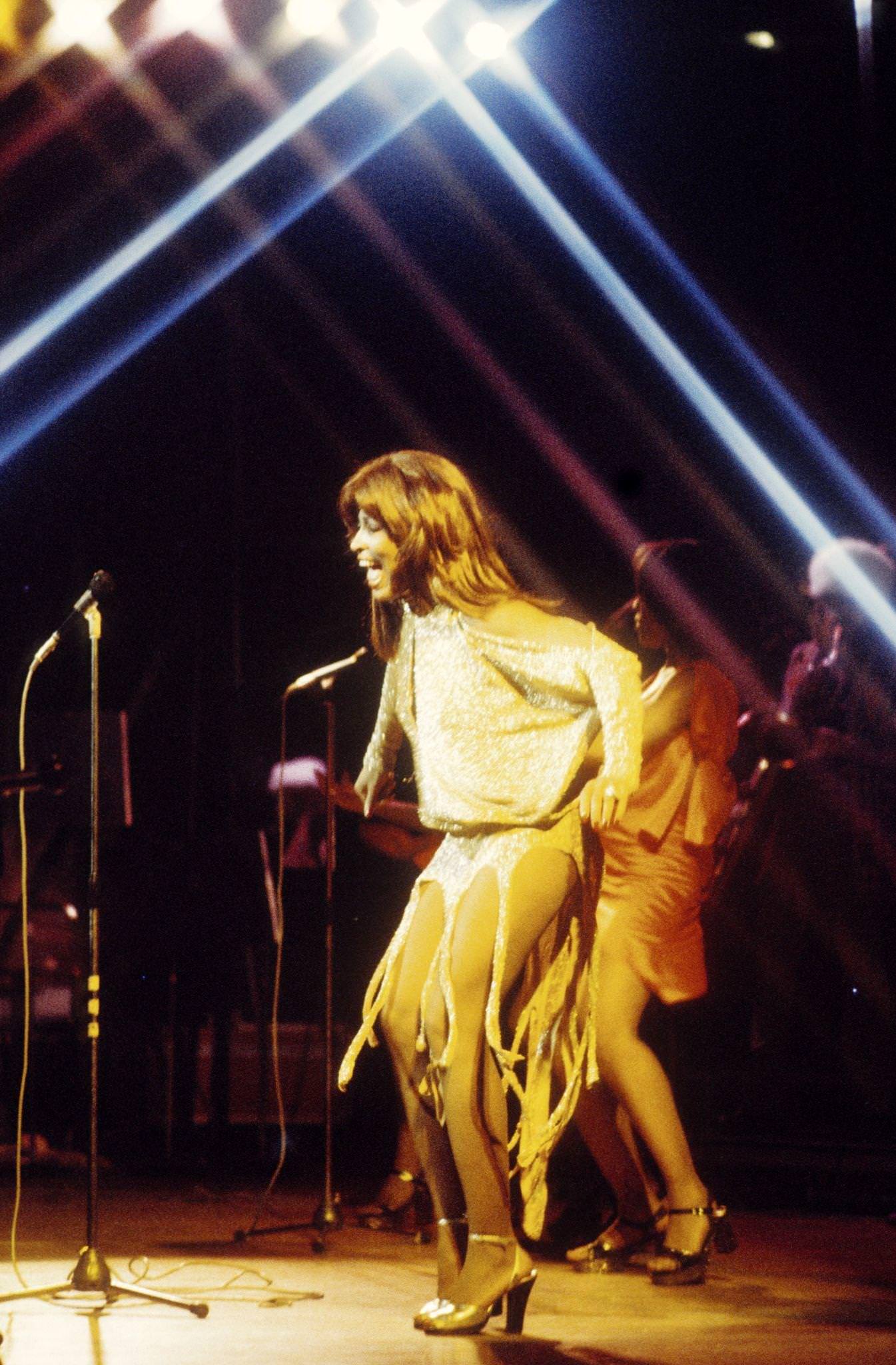 Tina Turner Performing On Stage. The Power Of Dance, Channeled Through The Grace And Beauty Of Her Legs.