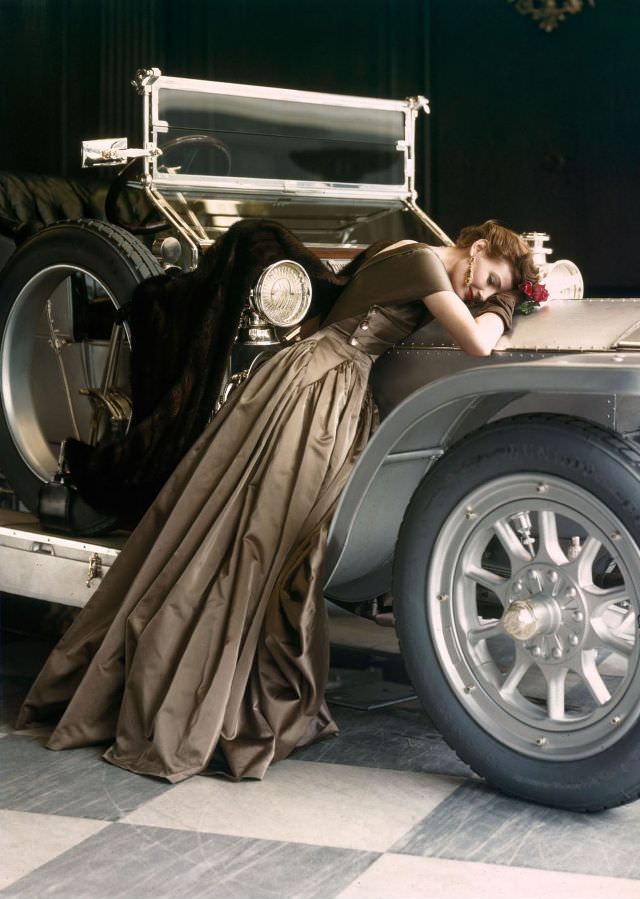 Wenda Parkinson In A Molyneux Satin Evening Dress Leaning On A 1907 Silver Ghost Rolls-Royce, 1950