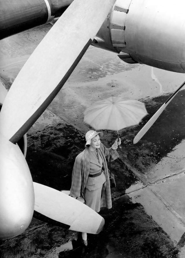 Wenda Parkinson In Suit And Coat By Matita, London Airport, Vogue, 1951