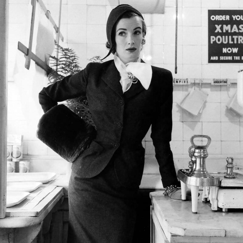Wenda Parkinson In A Classic Suit In Clerical Grey By Dorville, Flannel Hat By Simone Mirman, Vogue, 1952