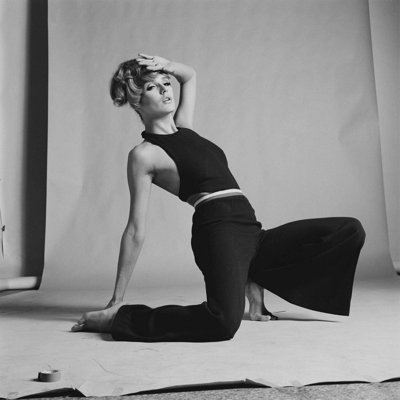 Fashion Model In Black Sleeveless Crop Top And Black High Waist Flared Pants In Bell Bottoms, 1970