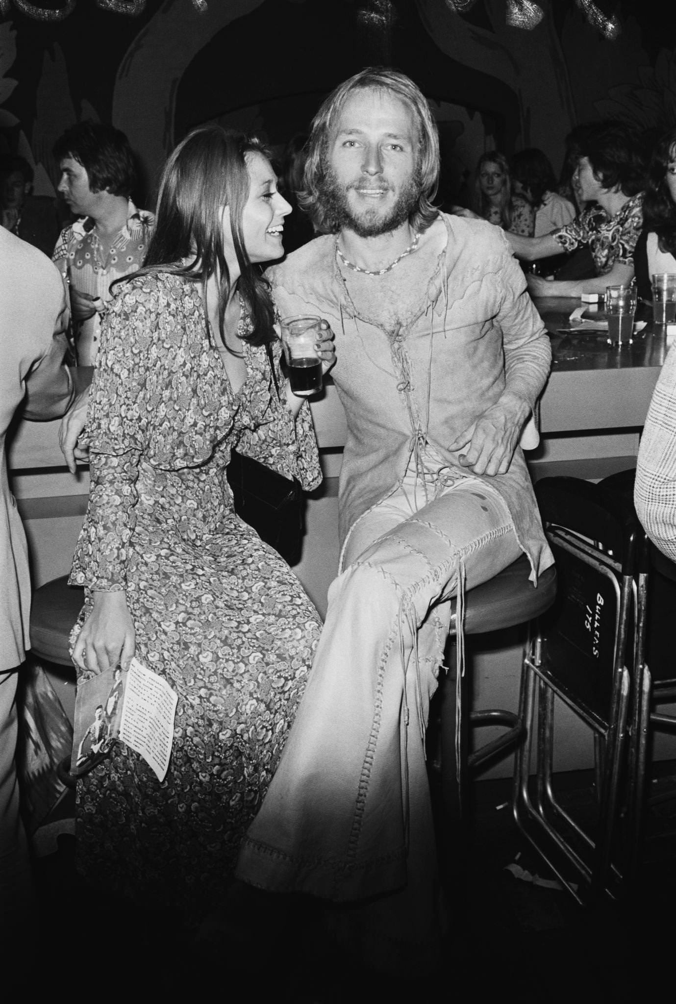 British Actor Mike Sarne With A Friend In Bell Bottoms At A Fashion Show, 1971