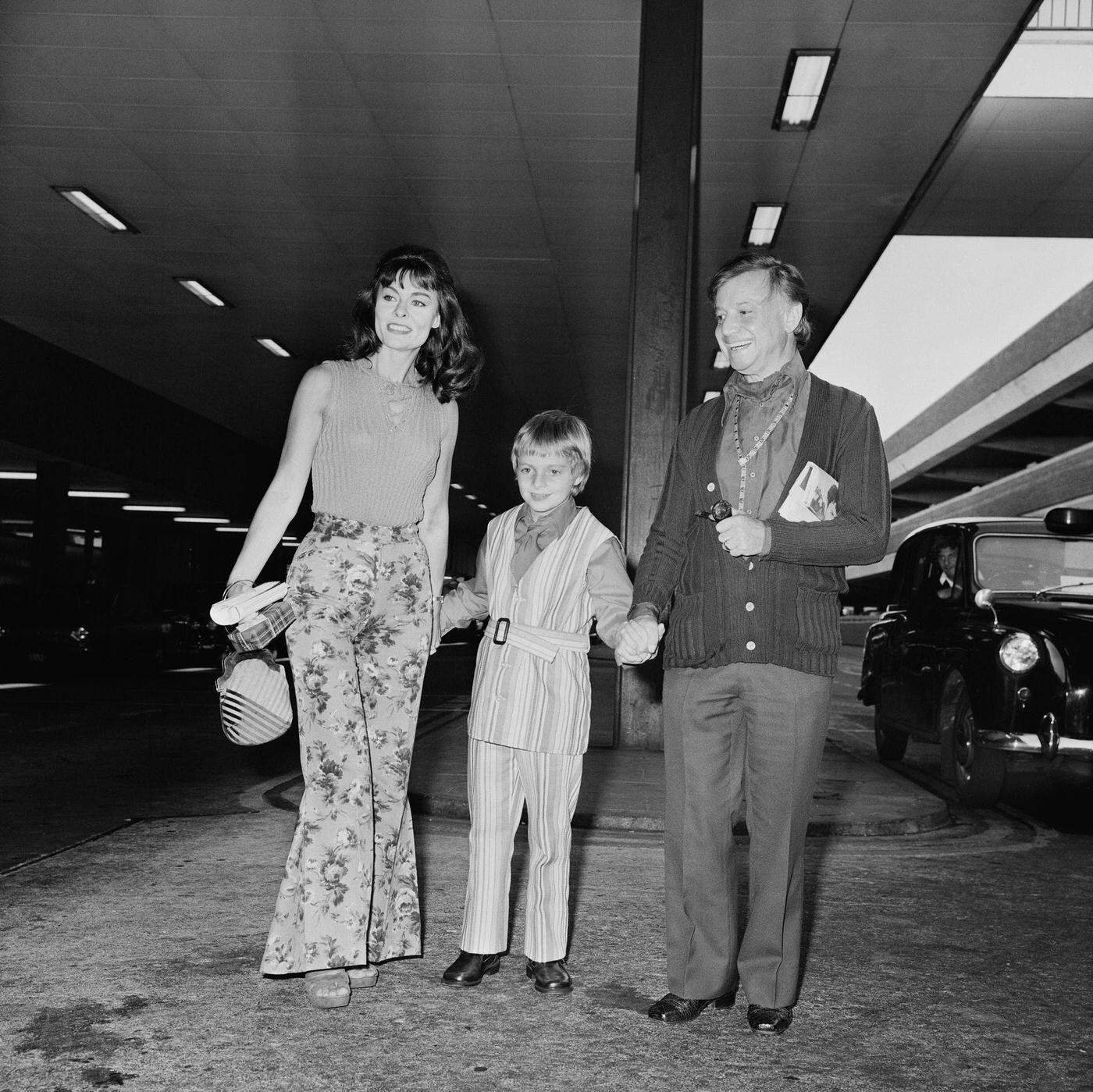 British Actress Anne Heywood And Family In Bell Bottoms At London Airport, 1971