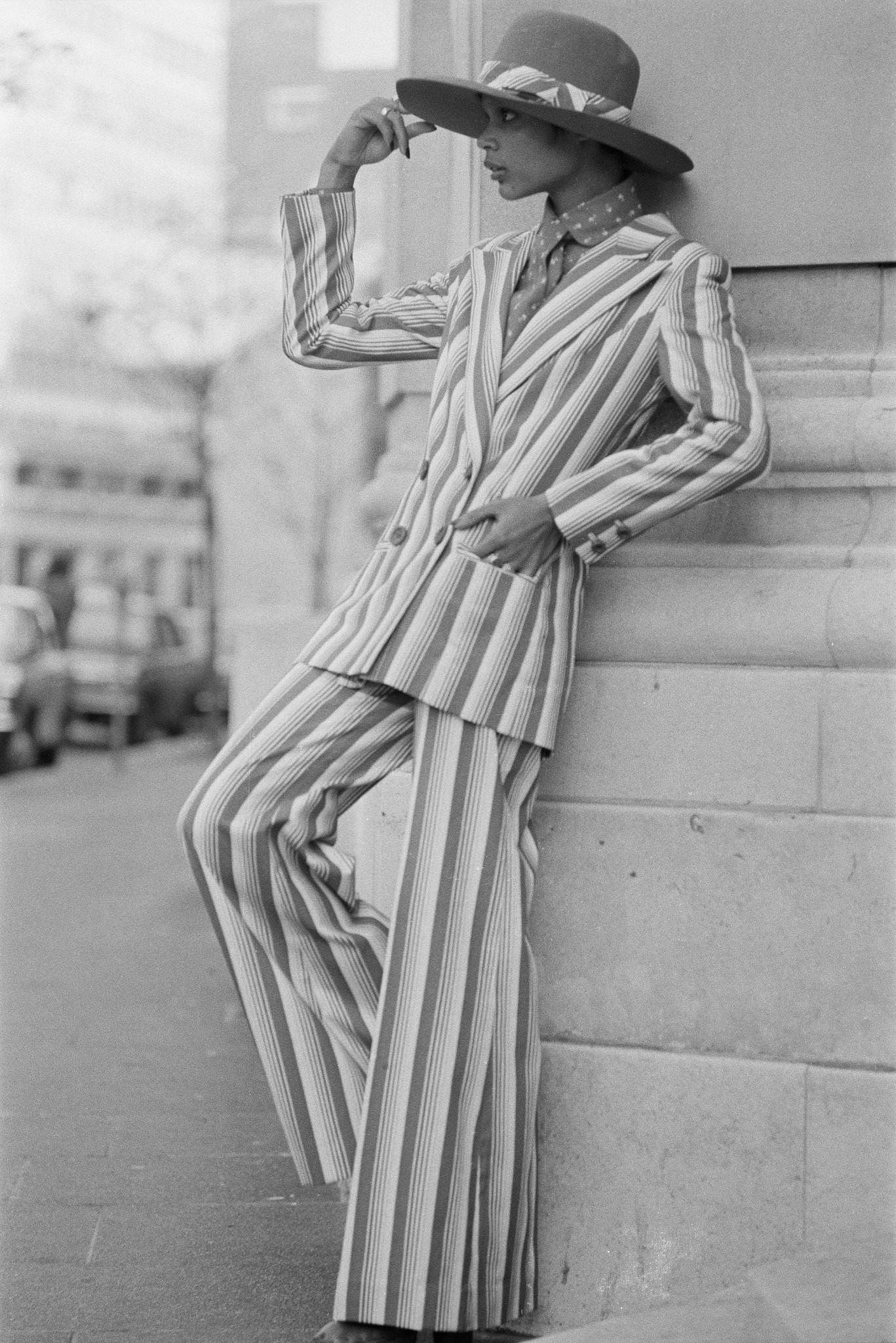 Model In Striped Trouser Suit And Wide-Brimmed Hat With Bell Bottoms, 1971