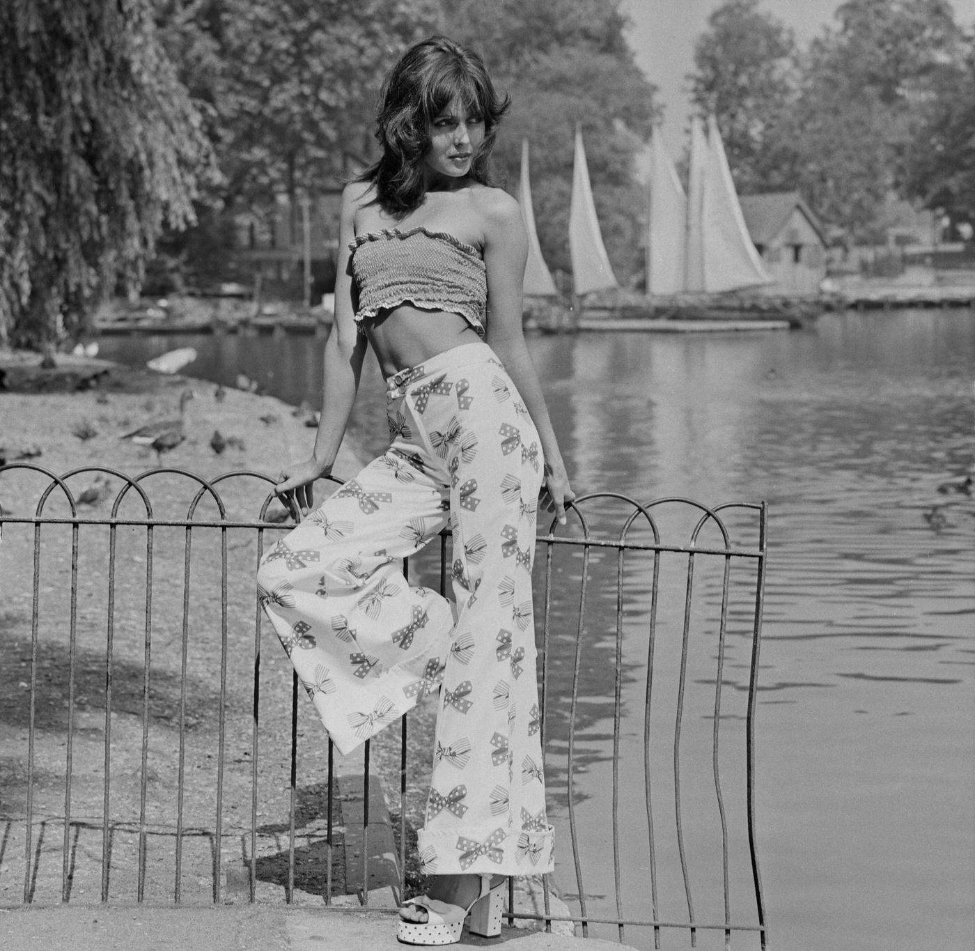 Model In Bell-Bottom High-Waisted Flared Trousers And Cropped Top At Regent'S Park, London, 1972