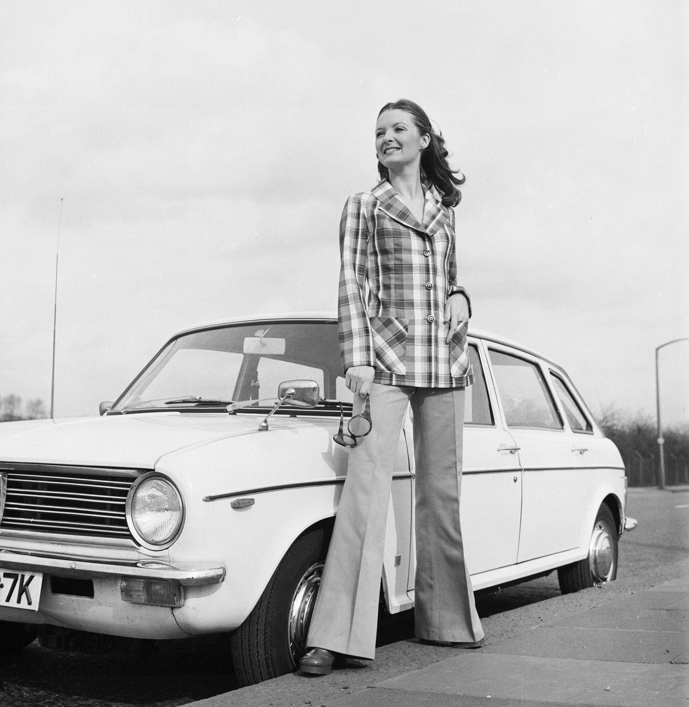 Model In A Flared Bell-Bottom Trouser Suit With A Hip-Length Check Jacket, 1973