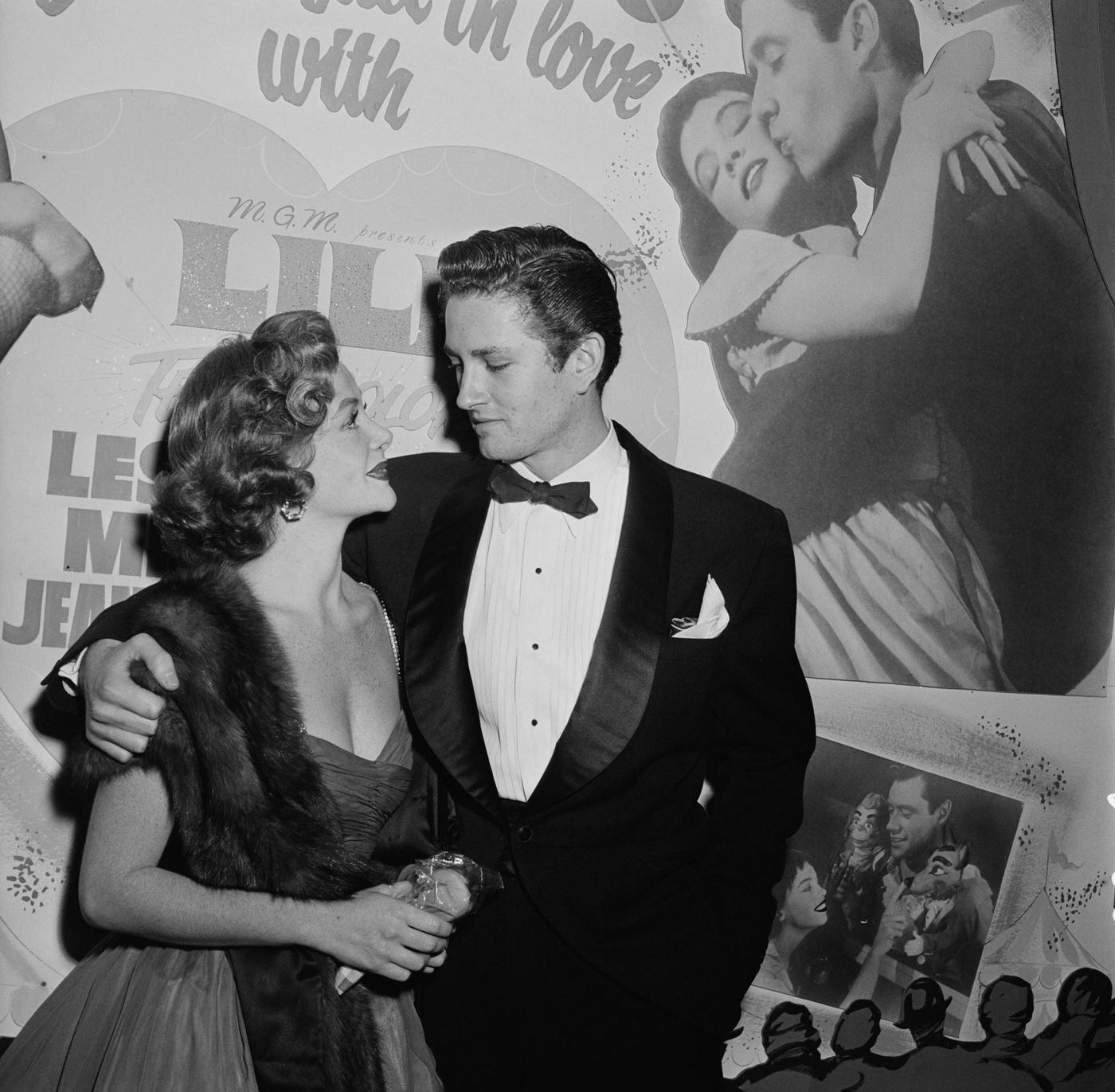 Dorothy Malone (1924-2018) And Actor Sydney Chaplin Attend The Premiere Of American Film 'Lili', Us, 1953.