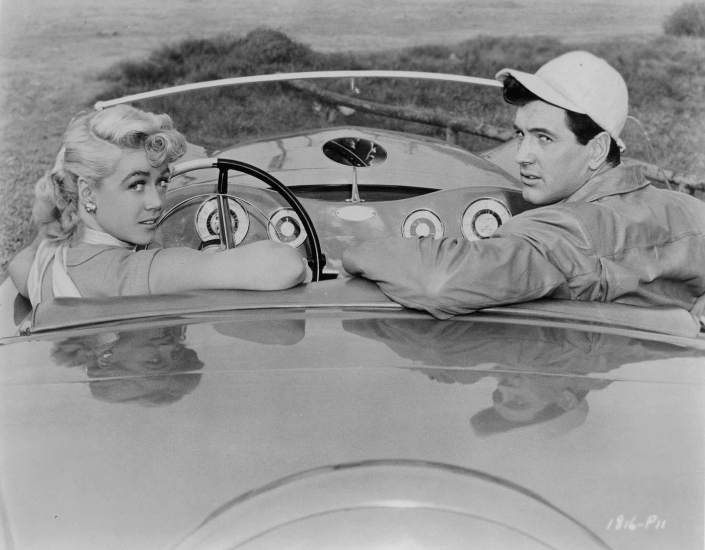 Dorothy Malone And Rock Hudson In A Car In A Promotional Portrait For The Film 'Written On The Wind', 1956.