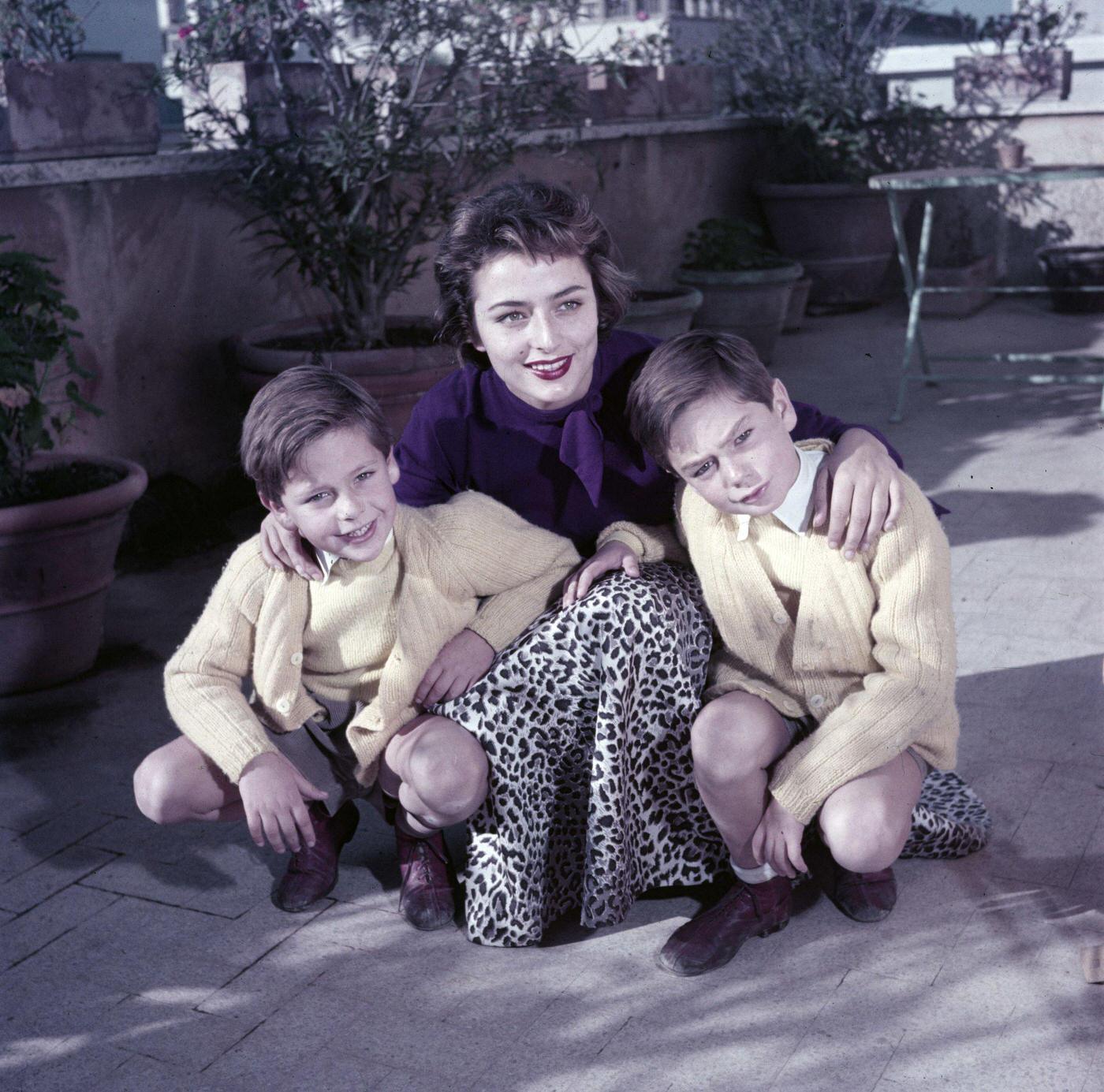 Rendezvous With Marina Berti In December 1952, On A Terrace, During A Portrait Session, In The Company Of Two Unidentified Children, Wearing A Leopard-Print Skirt And A Purple Sweater.