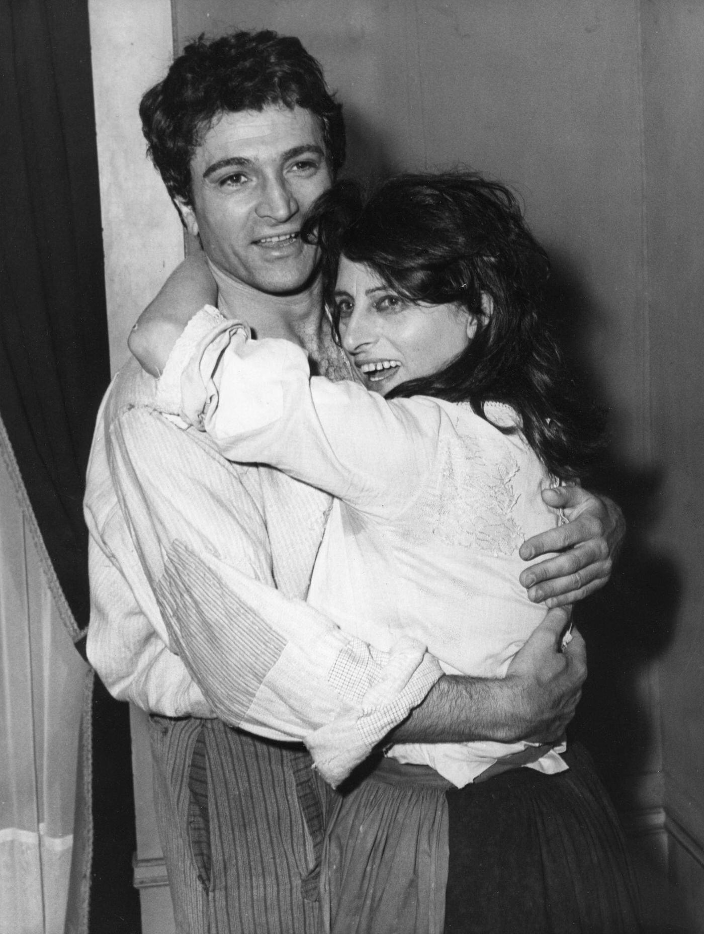 Anna Magnani In The Arms Of Her Stage Partner Osvaldo Ruggieri After A Performance Of 'La Louve' At The Théâtre Des Nations In Paris, France, June 1965