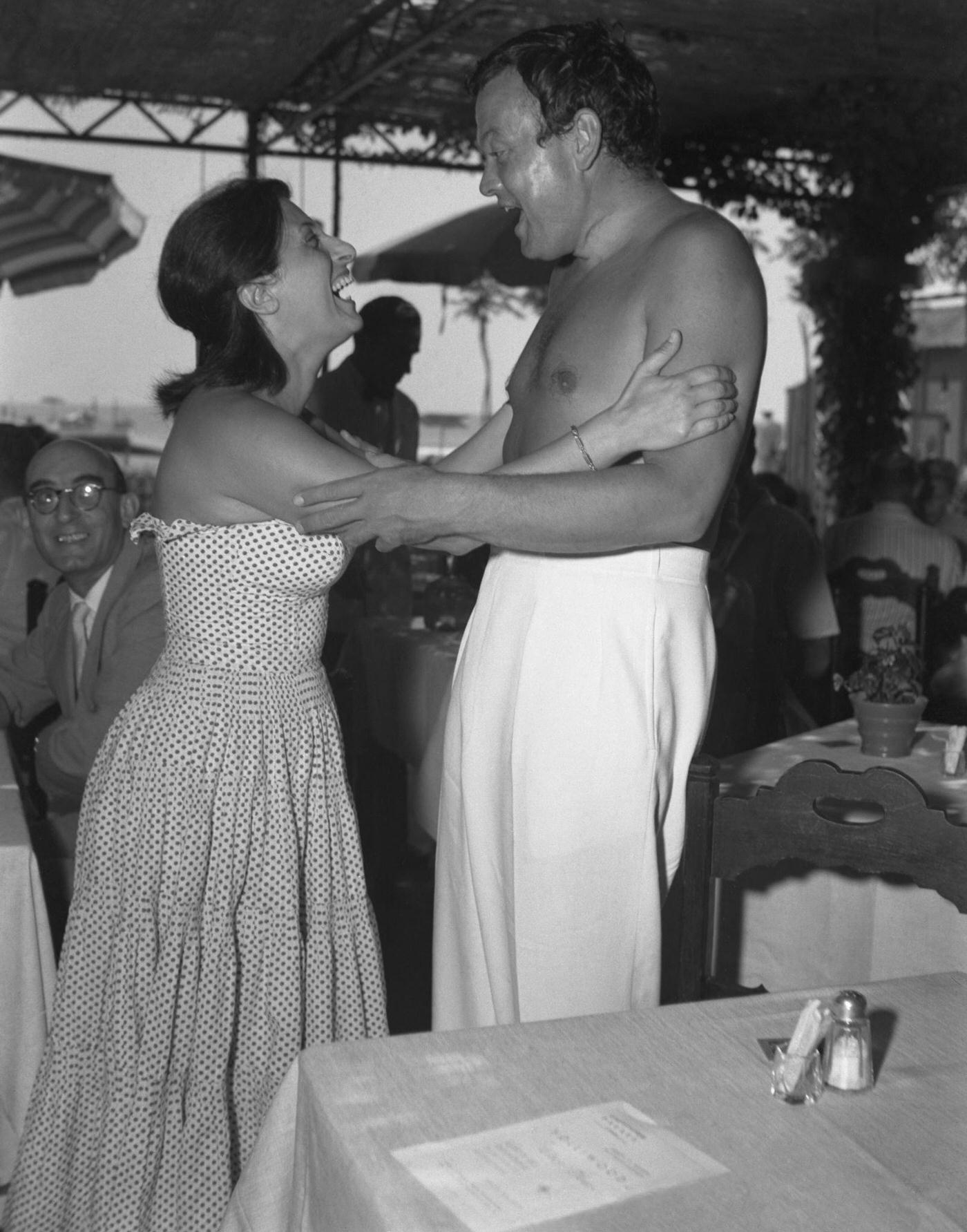 Orson Welles Hugging Anna Magnani On The Lido Beach In Venice, 1948