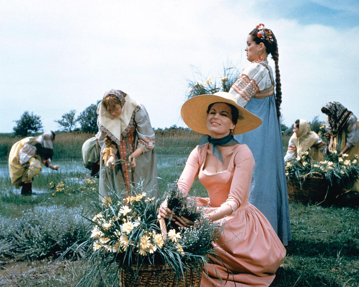 Anna Magnani Picking Flowers In A Scene From A Film, Circa 1945.