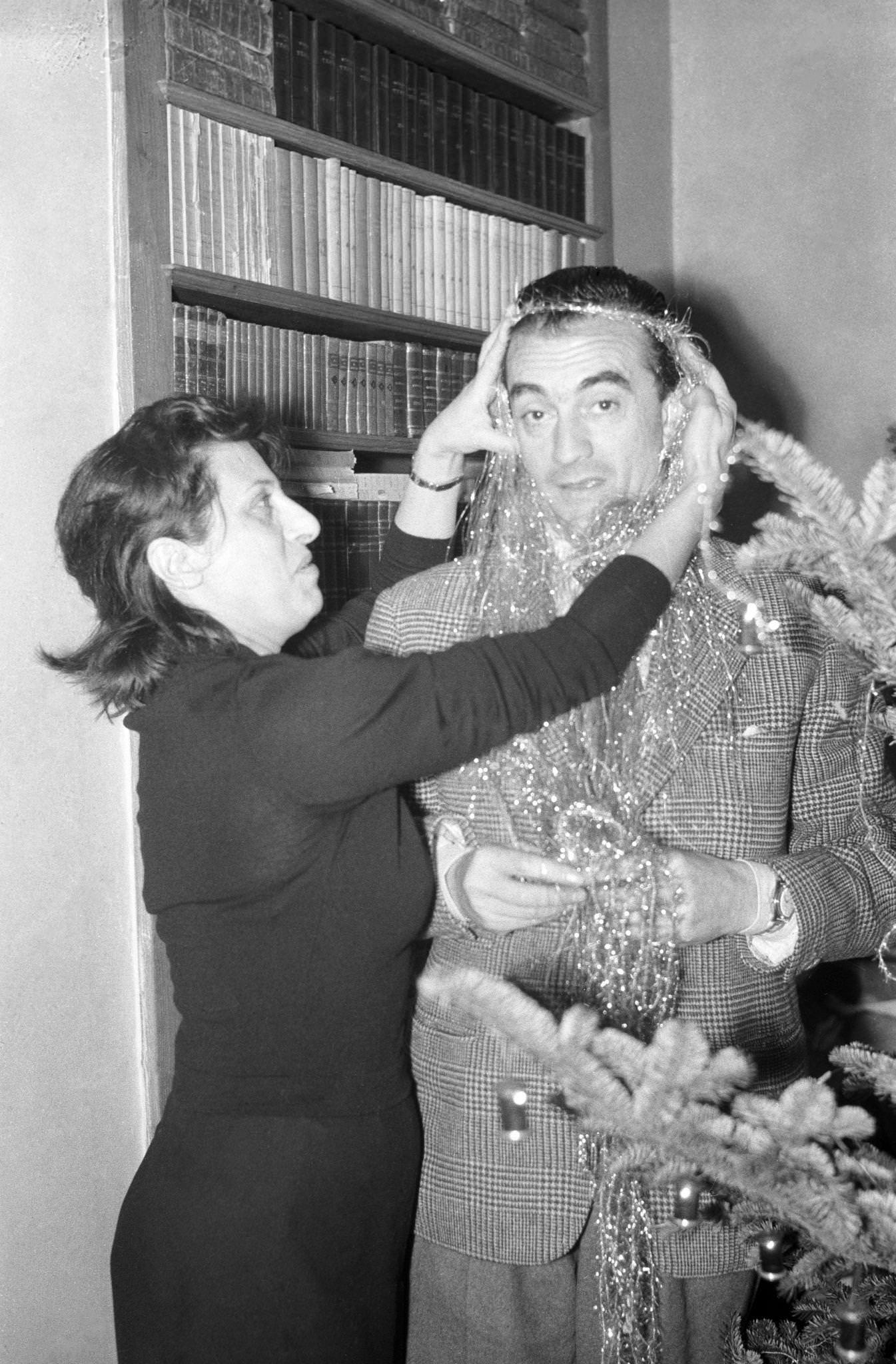 Luchino Visconti And Anna Magnani Joking Around While Decorating A Christmas Tree, 1951