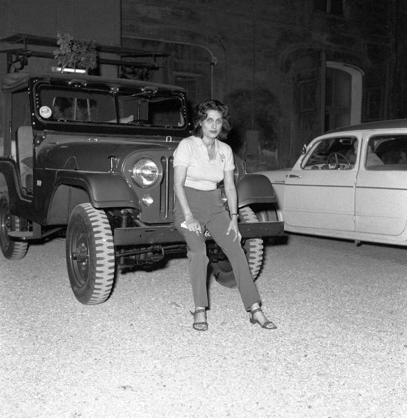 Anna Magnani Poses Next To Her Jeep In The Courtyard Of Her Mansion In Italy, 1957.