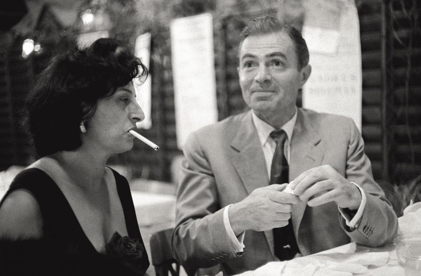 Anna Magnani Waits For James Mason To Light A Cigarette During The 17Th Venice International Film Festival, 1956.