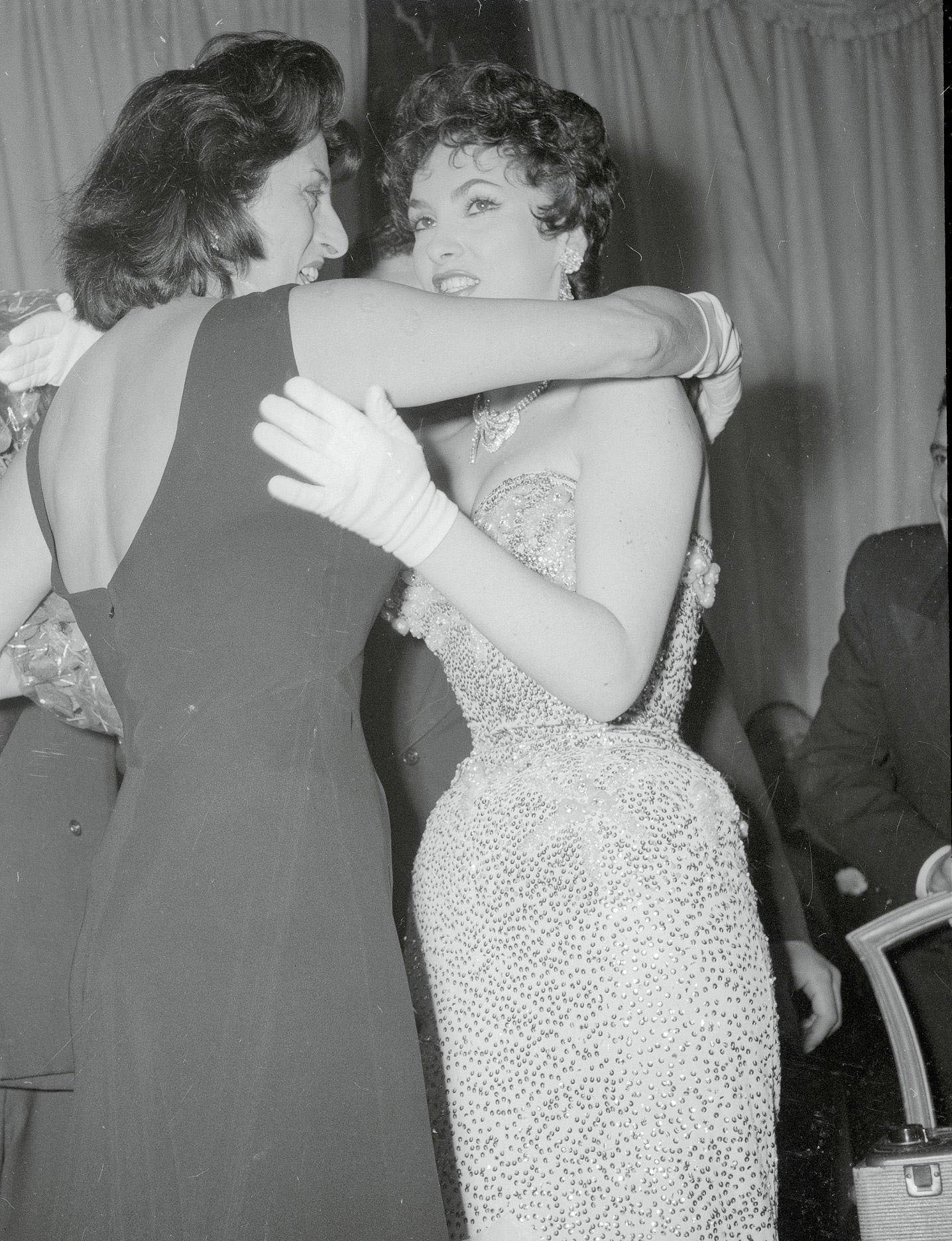 Anna Magnani Hugs Gina Lollobrigida After Receiving A Golden Medal At A Cinema Gala In Rome. Magnani, 1955
