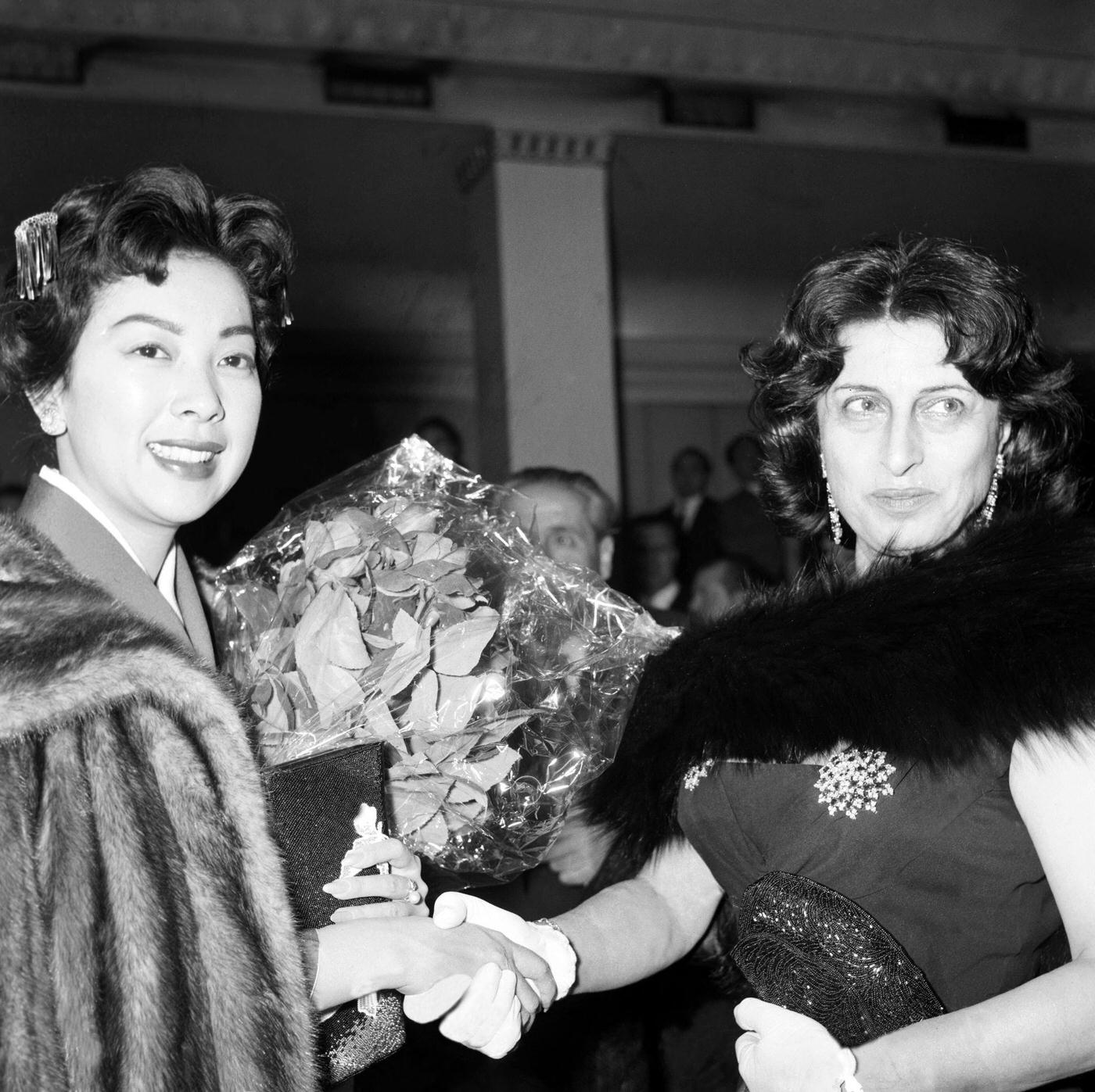 Japanese American Actress Miiko Taka Shakes Hands With Anna Magnani At The Premiere Of The Film &Amp;Quot;Sayonara&Amp;Quot; At Sistina Theatre In Rome, 1958