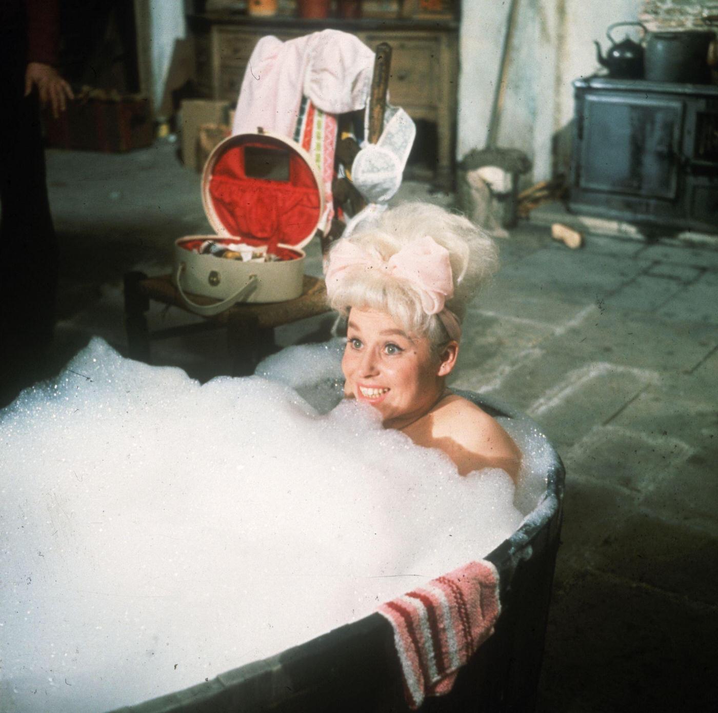 Barbara Windsor In A Bubble Bath During The Filming Of 'Crooks In The Cloisters'.
