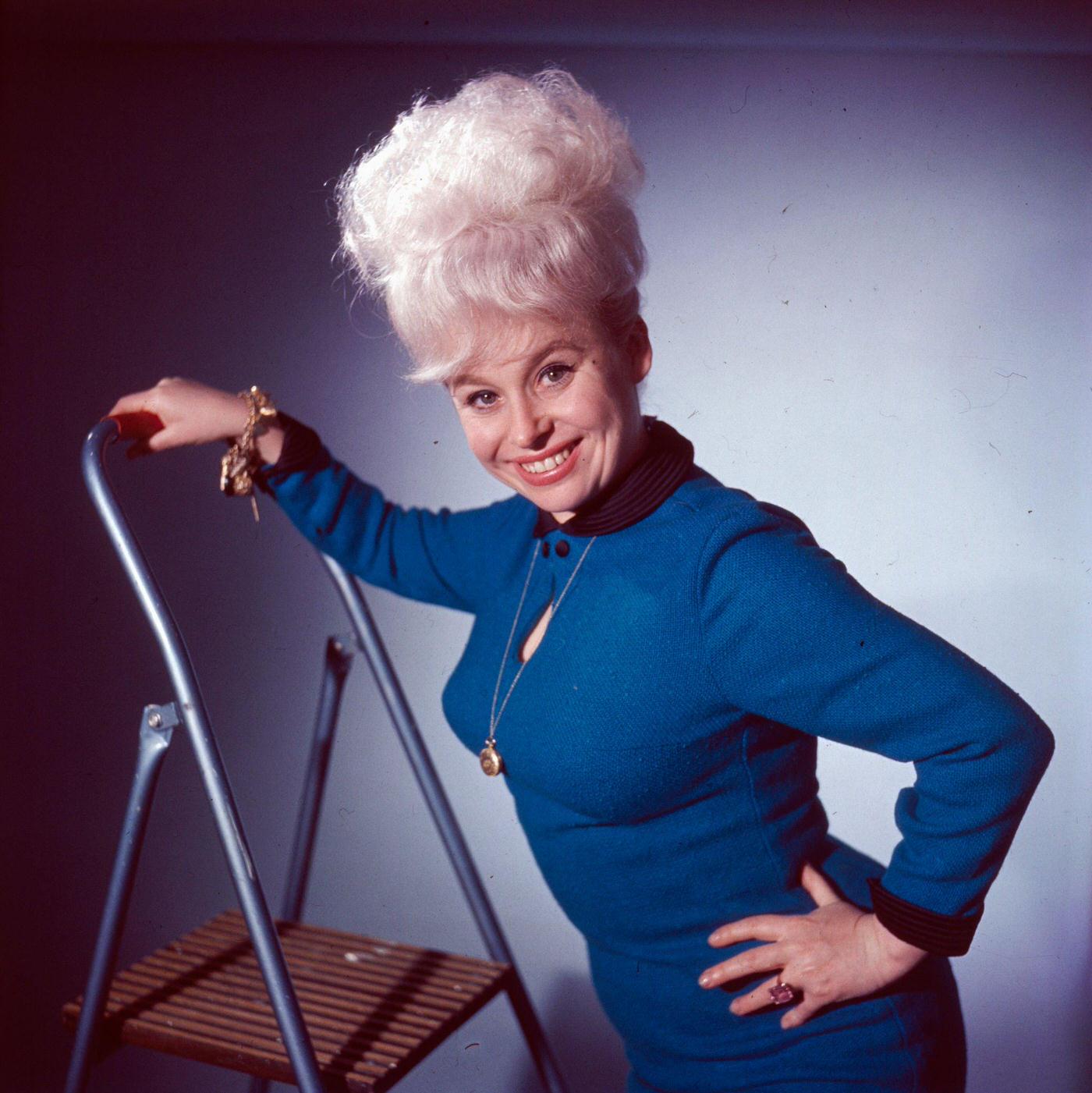 Barbara Windsor In A Blue Dress On A Ladder, 1963.