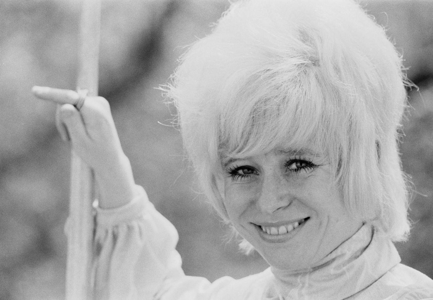 Peter Butterworth And Robin Askwith Watch Feuding Actresses Margaret Nolan And Barbara Windsor In The Film 'Carry On Girls', 1973.
