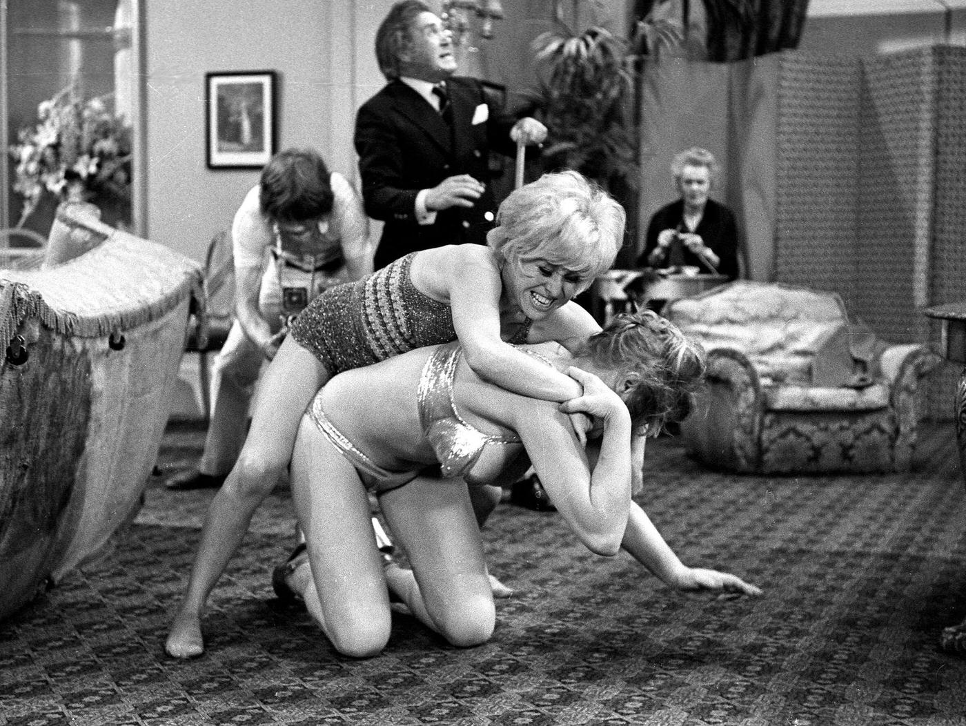 Peter Butterworth And Robin Askwith Watching Margaret Nolan And Barbara Windsor In 'Carry On Girls', 1973.
