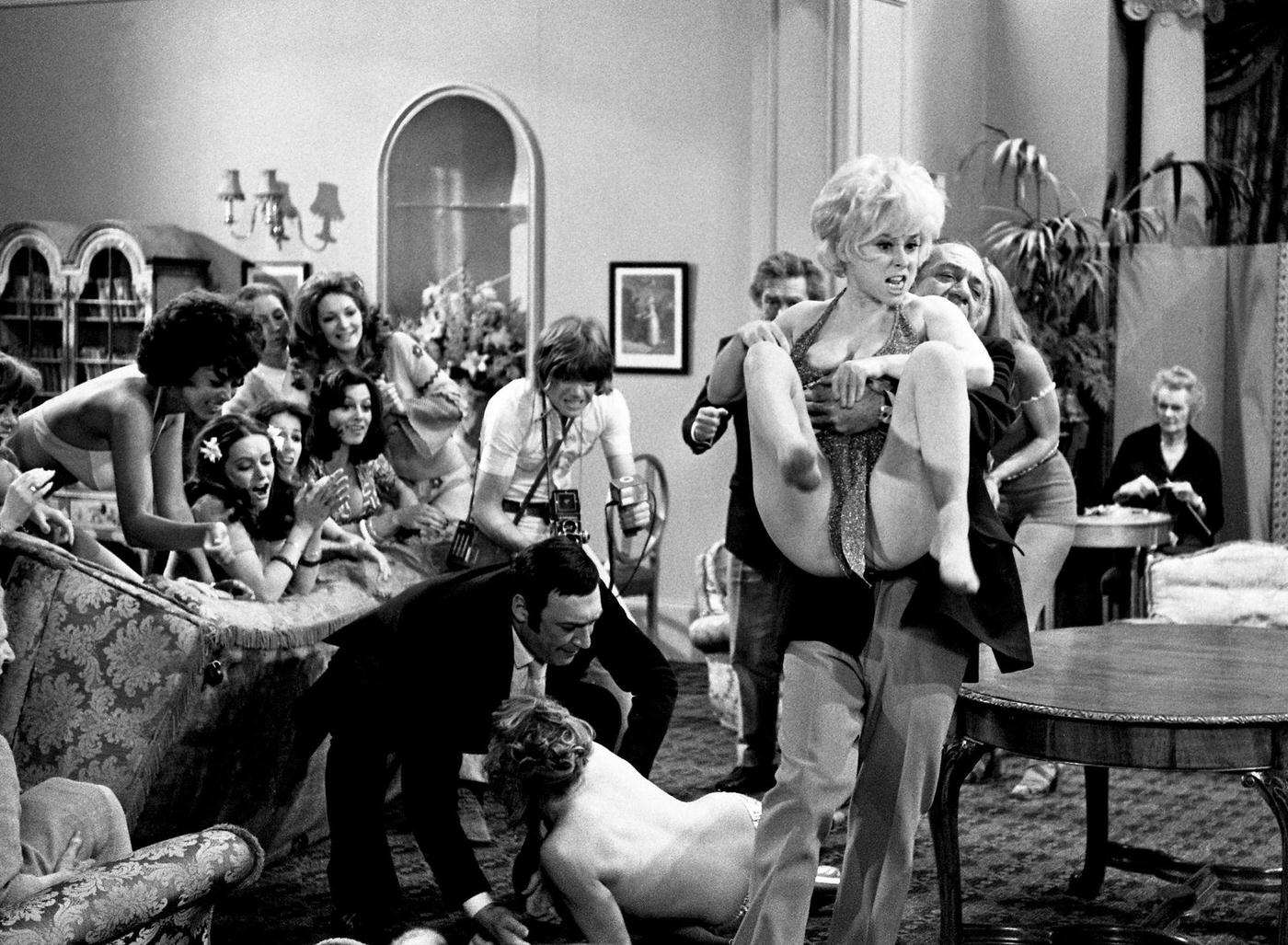 Barbara Windsor And Sid James In A Scene From 'Carry On Girls', 1973.