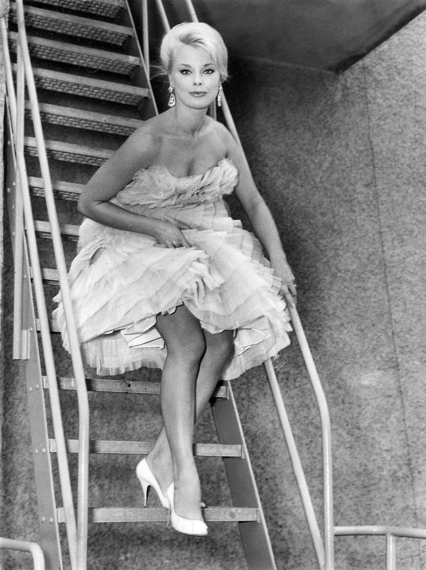 Elke Sommer In A Full Gown On A Staircase, 1960.