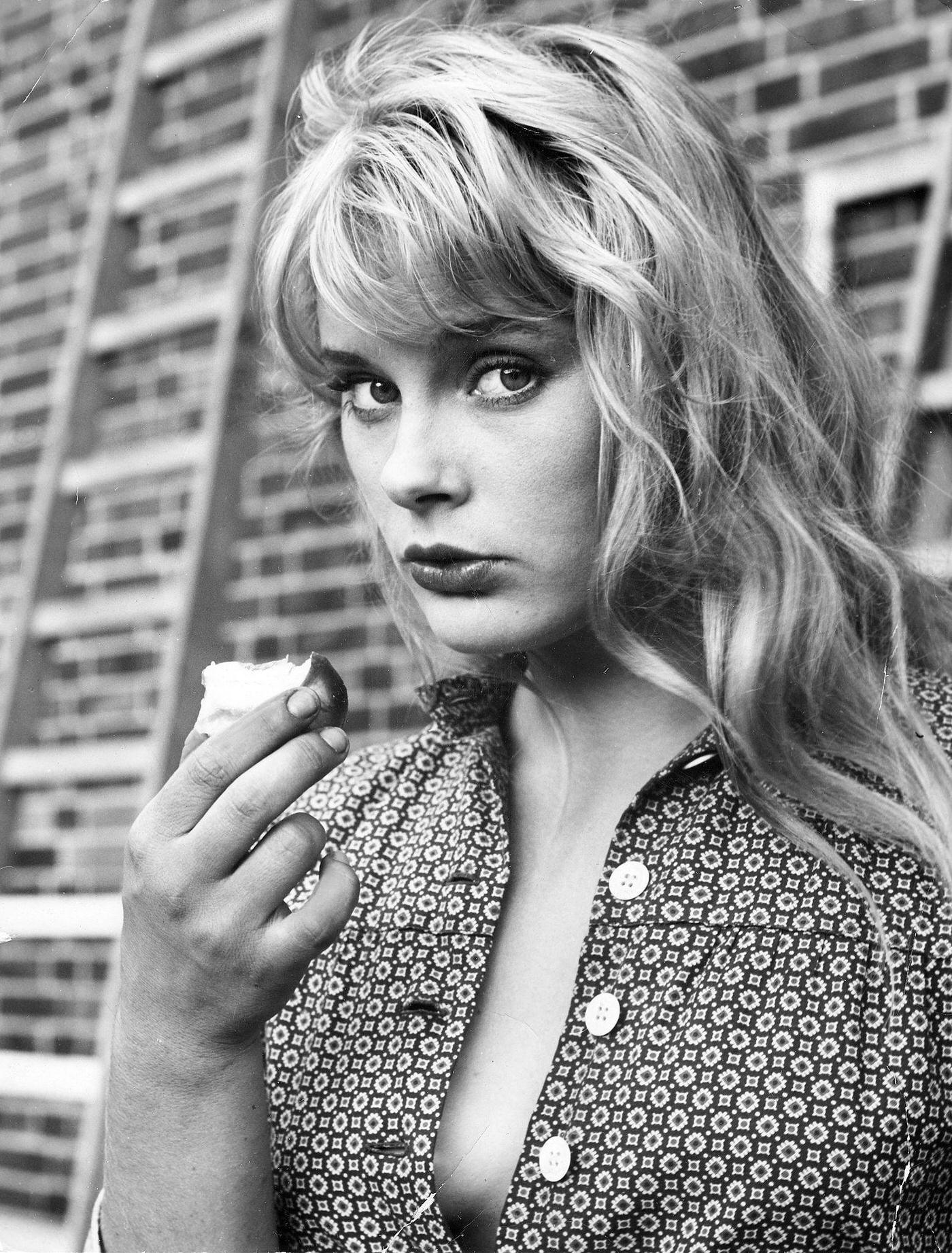 Elke Sommer Eating An Apple In A 1959 Portrait By Gerd Kreutschmann.